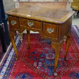 A reproduction cross-banded mahogany lowboy, 3 frieze drawers, on shell carved cabriole legs, W72cm,