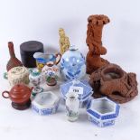 A candlestick with dragon support, 19cm, and another, small Oriental vases, a teapot etc