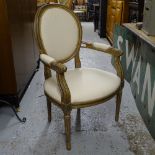 A Continental style carved giltwood open arm salon chair