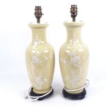 A pair of Chinese beige glazed baluster vase table lamps, overall height 42cm