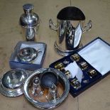 A silver plated cocktail shaker, syphon stand, coasters, cruets etc