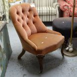 A Victorian button-back upholstered nursing chair, on scrolled cabriole legs