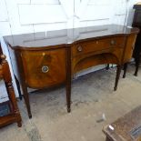 A large Antique mahogany and ebony-strung serpentine-front sideboard, fitted with drawers and
