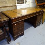 A reproduction mahogany twin-pedestal partner's writing desk, W148cm, H66cm, D86cm, kneehole