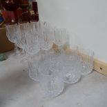 A suite of crystal glassware, comprising wine goblets, Sherry glasses and Whisky tumblers