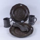 A pair of Continental eagle decorated pewter wall plaques, 29cm, a pewter tankard, jug and snuffer
