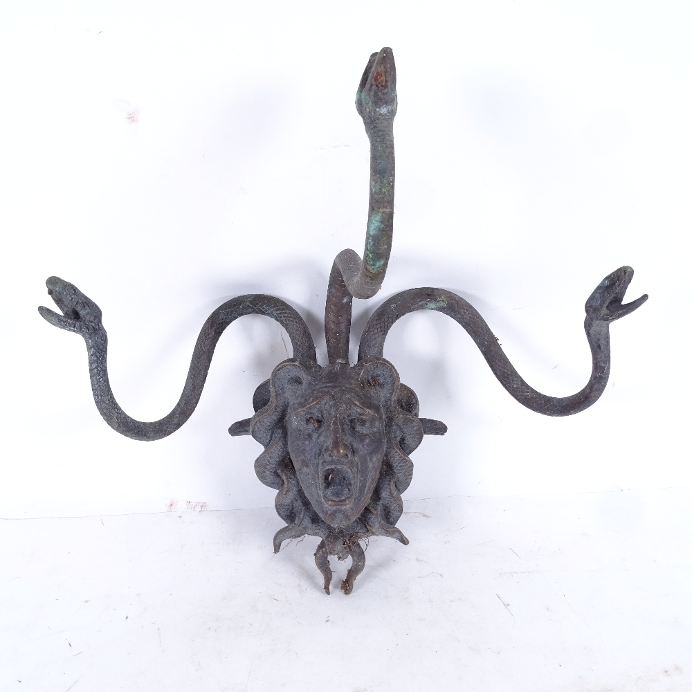 A bronze wall-mounted study of Medusa, width 34cm