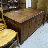 A large stained panelled pine coffer, W129cm, H68cm, D73cm