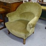 A late Victorian upholstered armchair on cabriole legs