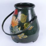 A large Toleware aluminium bucket, printed floral decoration with swing handle, height 36cm