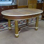 A 1920s Art Deco oval dining table, with gilt and cream base, L150cm, H77cm, D110cm (no spare leaf