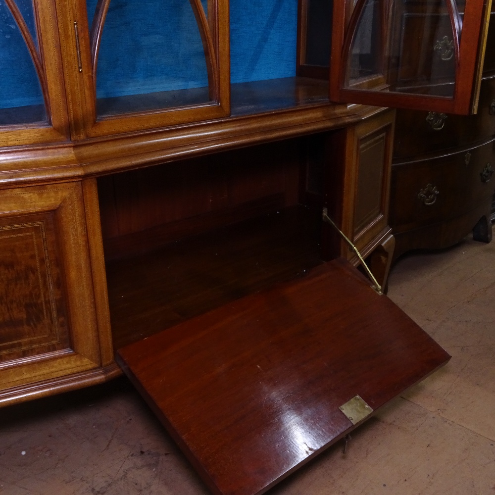 An Edwardian mahogany and satinwood-banded display cabinet of canted form, with lattice-glazed doors - Image 2 of 2