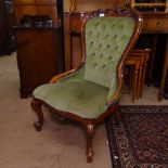 A carved mahogany-framed button-back upholstered nursing chair