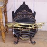 An Antique embossed cast-iron fireback, W49cm, H70cm and a ducks nest grate and fire irons