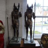 A pair of Egyptian Anubis guardian figures, 1 A/F, H125cm