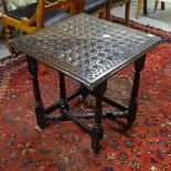An Antique oak triangular single drop leaf table, with allover chip carved decoration, W82cm, H69cm
