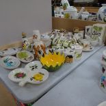 Various Tony Raymond pottery, including salt and vinegar jugs, butter dish, piggy bank, pot scourers