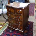 A reproduction cross-banded chest of 4 short drawers, of serpentine form, W48cm, H72cm, D40cm