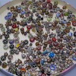 A collection of glass and plated charms