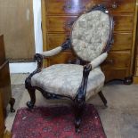 A Victorian carved mahogany-framed open armchair