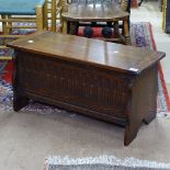 A small rectangular oak coffer with carved panelled front, W80cm, H40cm, D34cm