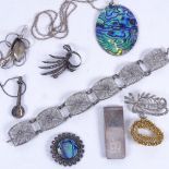 A silver filigree panel bracelet, an abalone pendant necklace, a brooch, and various other silver