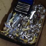 A large quantity of mixed plated cutlery, a plated toast rack etc