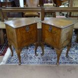 A pair of early 20th century oak bedside cabinets, the fall-fronts revealing shelves and fitted