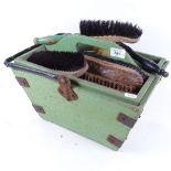 An early 20th century green painted shoe cleaner's set and brushes