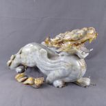 A carved hardstone dragon (A/F), length 52cm