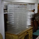 A perspex multi-section filing cabinet, W123cm, H99cm, D39cm