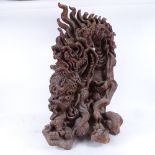 An African carved hardwood study of a dragon, height 72cm