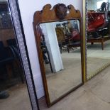 A Georgian walnut wall mirror, with shaped pediment and acanthus leaf mount, W58cm, H97cm