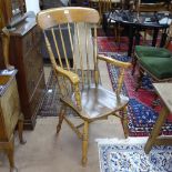 An Antique elm-seated stick-back kitchen chair