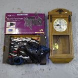 An oak-cased wall clock, a TV wall bracket, inline skates etc