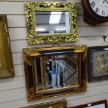 2 modern gilt-framed wall mirrors