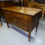 A small Edwardian mahogany and satinwood-banded sideboard, with cupboards and drawers, on square
