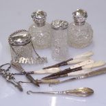 A quantity of silver items, to include silver-topped jars, mother-of-pearl handled manicure items,