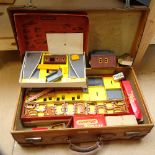 A group of Vintage Triang Railways scale model buildings, including station set, engine shed etc (