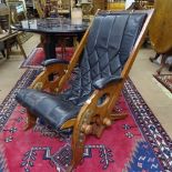 An Anglo-Indian campaign chair with leather slung seat, in the manner of Herbert McNair