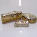 An early 20th century silver-backed dressing table brush set, and a silver-topped box with
