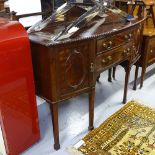 A late Victorian mahogany bow-front sideboard, raised pierced back, with fitted drawers and