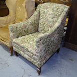 An Edwardian upholstered armchair