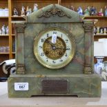 An early 20th century green onyx 8-day architectural mantel clock, cream enamel dial with Arabic