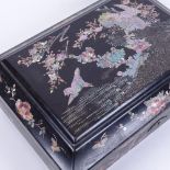 An early 20th century Japanese black lacquer and abalone rectangular jewellery box, bird and