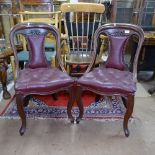 A pair of 19th century mahogany side chairs, with studded buttoned leather upholstery, on cabriole