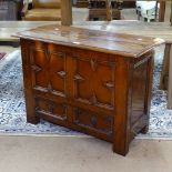 A small Antique oak mule chest, with panelled front, on stile legs, W81cm, H79cm, D37cm