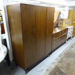 A mid-century teak G Plan wardrobe, W122cm, H170cm, and a matching 8-drawer chest, L150cm, H85cm