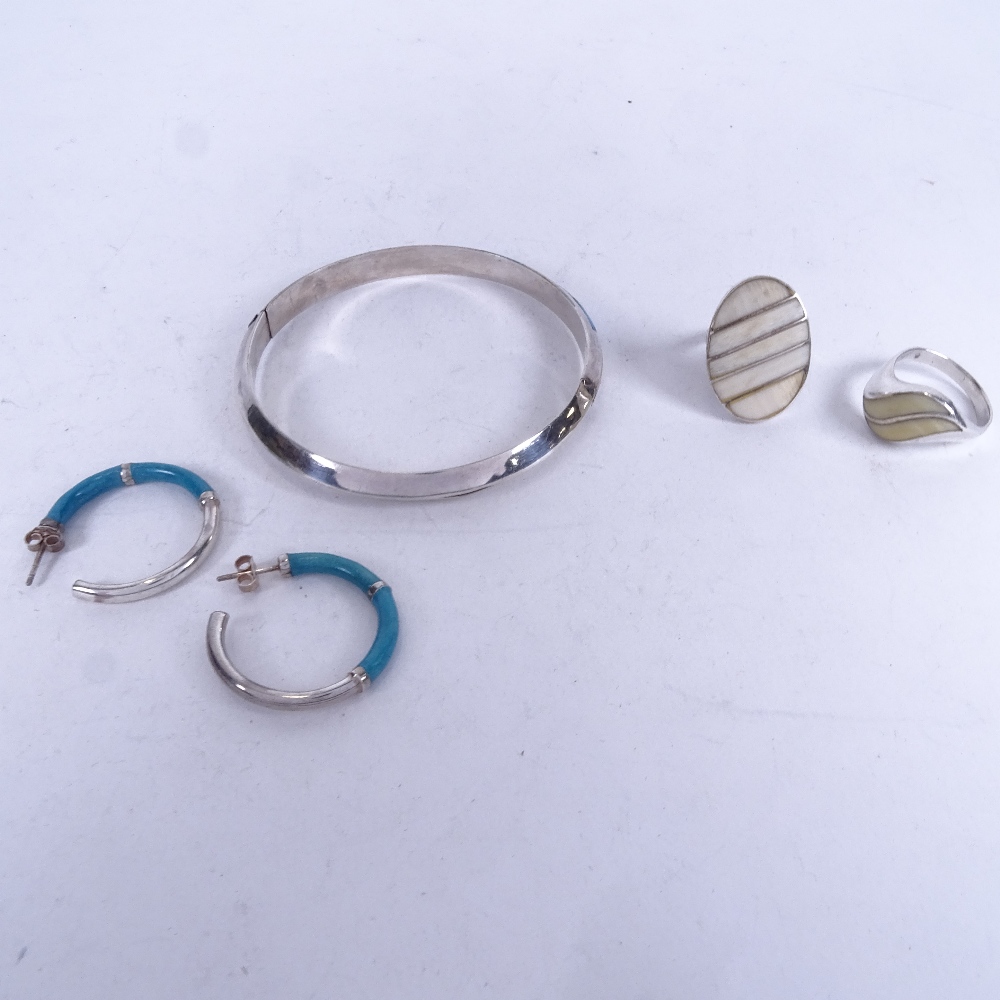 A group of sterling silver, turquoise and marine ivory set jewellery, a pair of earrings and