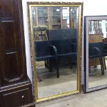 A modern gilt-framed bevel-edge wall mirror, 130cm x 70cm